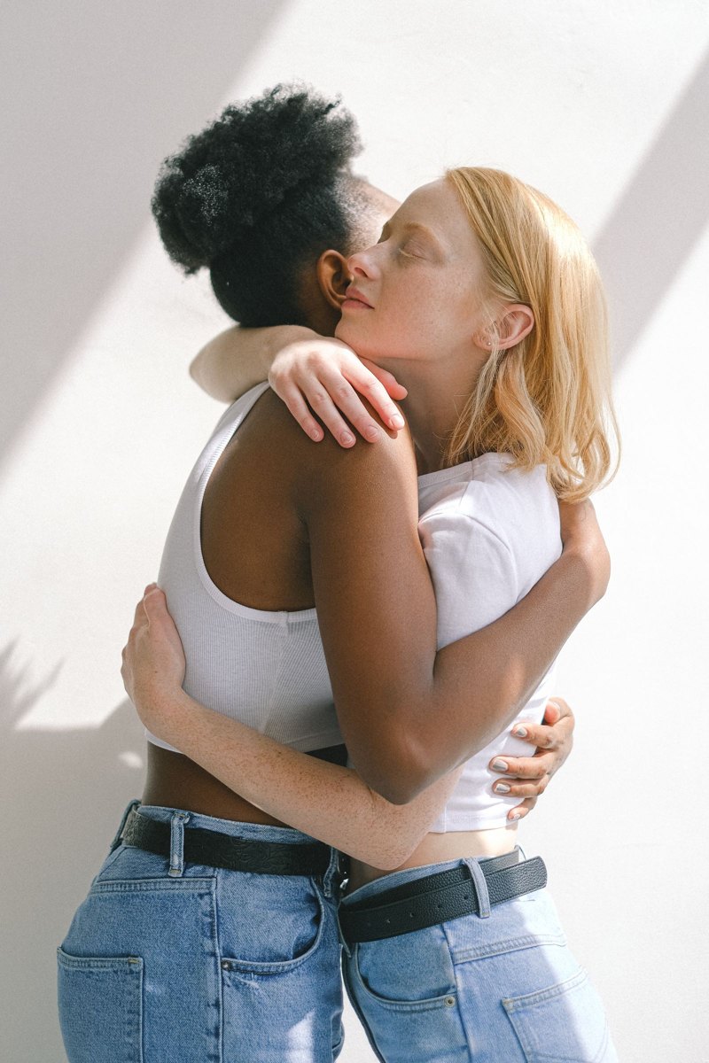 Two adults sharing a comforting embrace